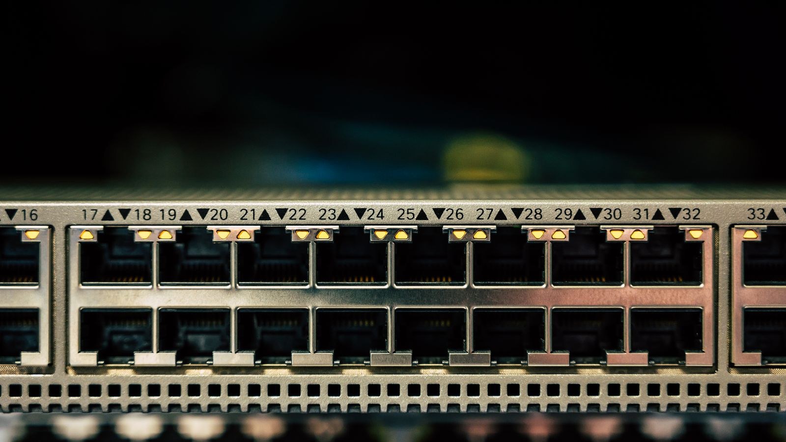 Close-up of a PoE network switch showing multiple ethernet ports and LED status indicators