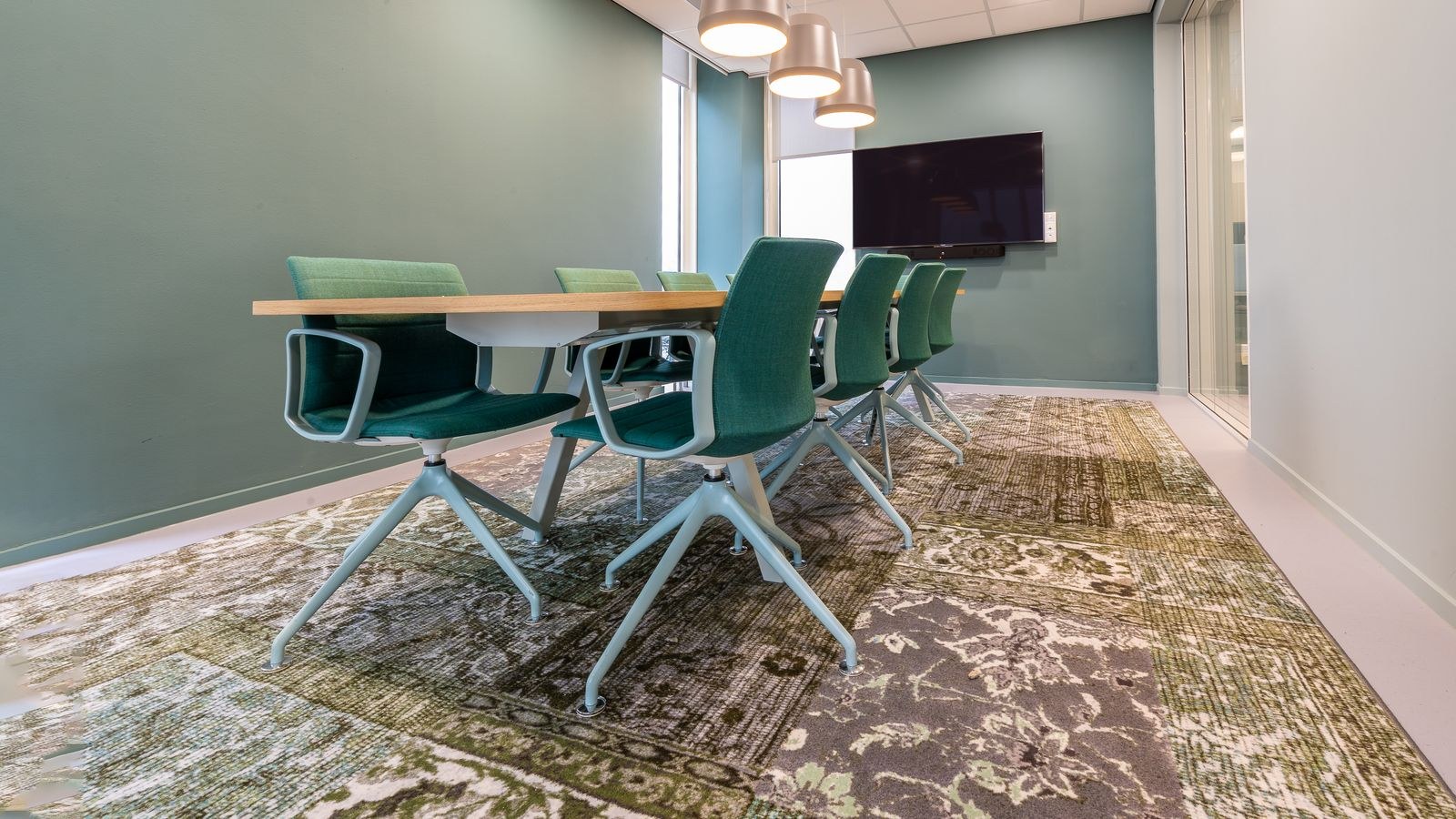 Chair mat placed under a desk to protect carpet from rolling wheels