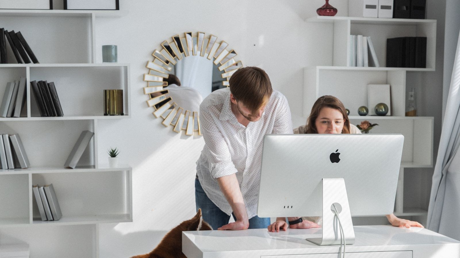 Adjustable desk legs and frame supporting a raised wooden desktop