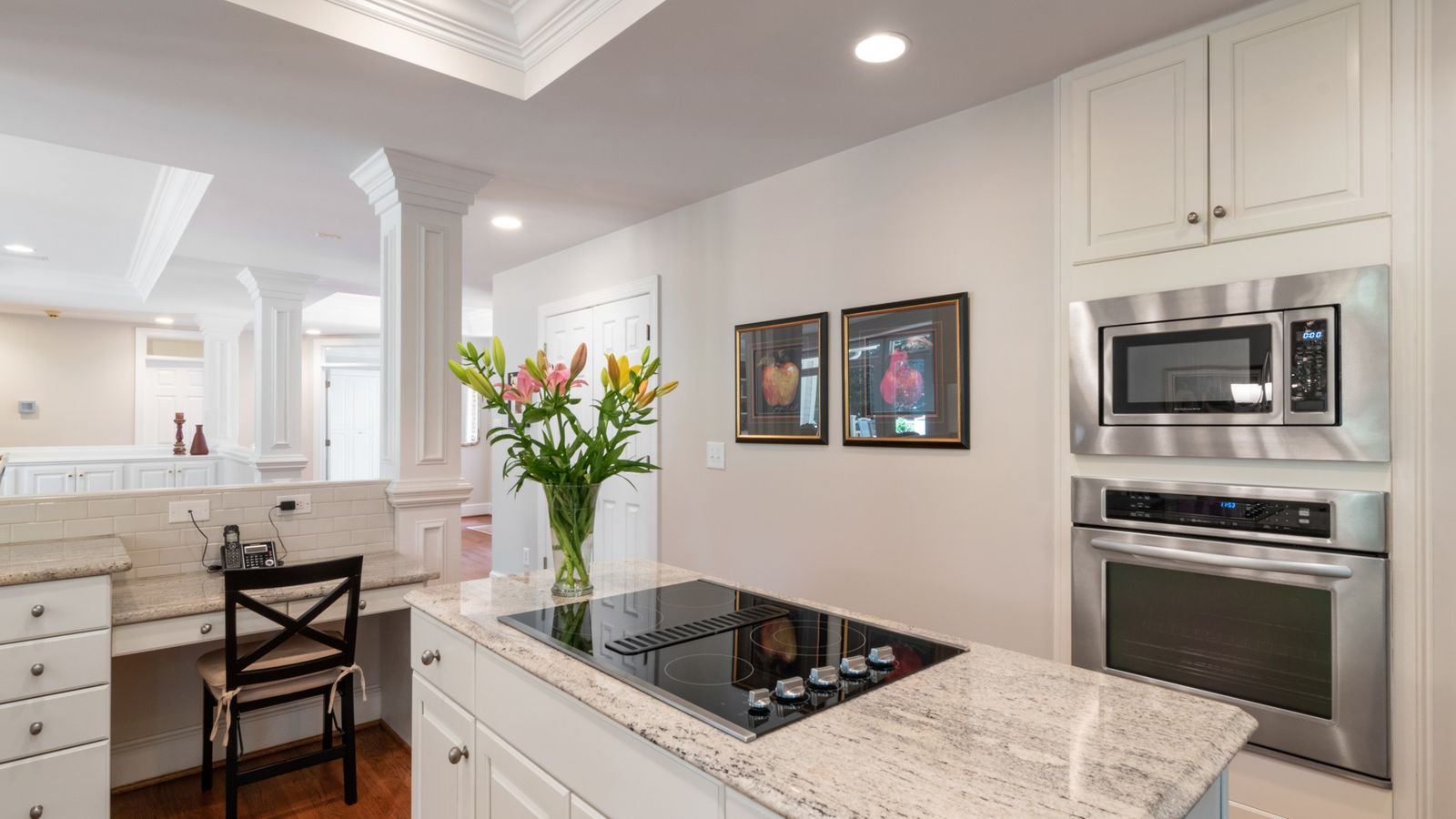 Small recessed downlights in a bathroom ceiling above a vanity mirror