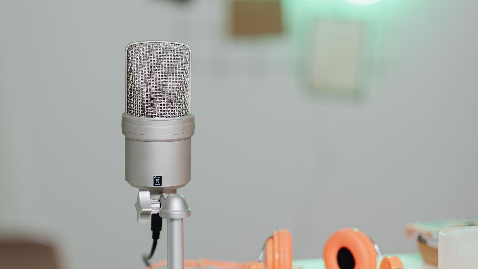 Quiet home studio corner with soft furnishings for better microphone sound