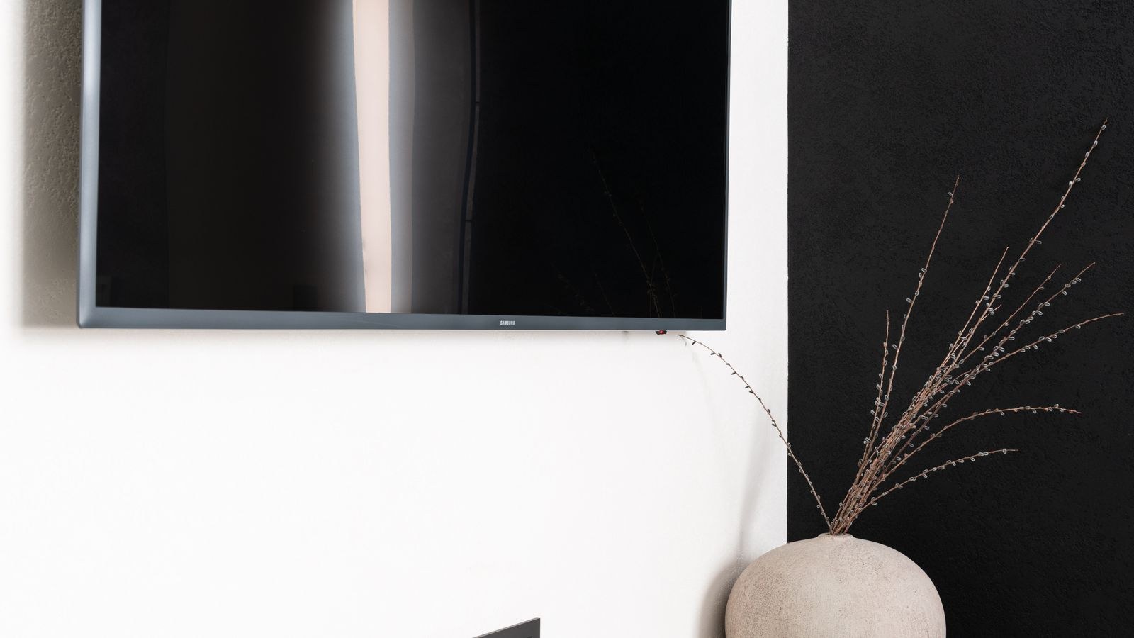 Modern television mounted on a wall away from direct window light