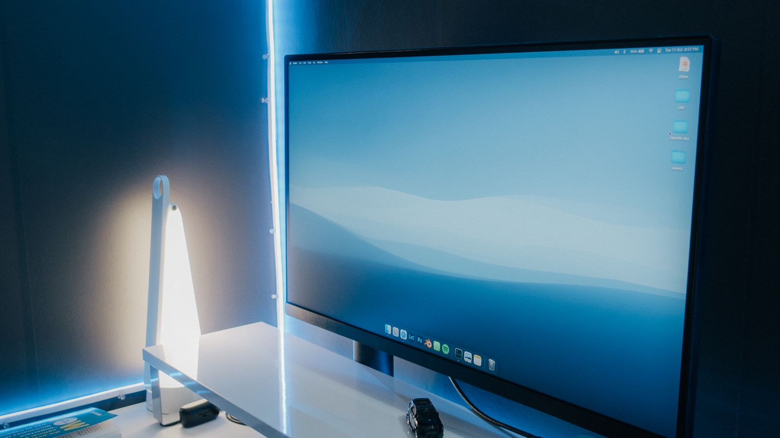 A desktop computer workstation comparing new and refurbished hardware
