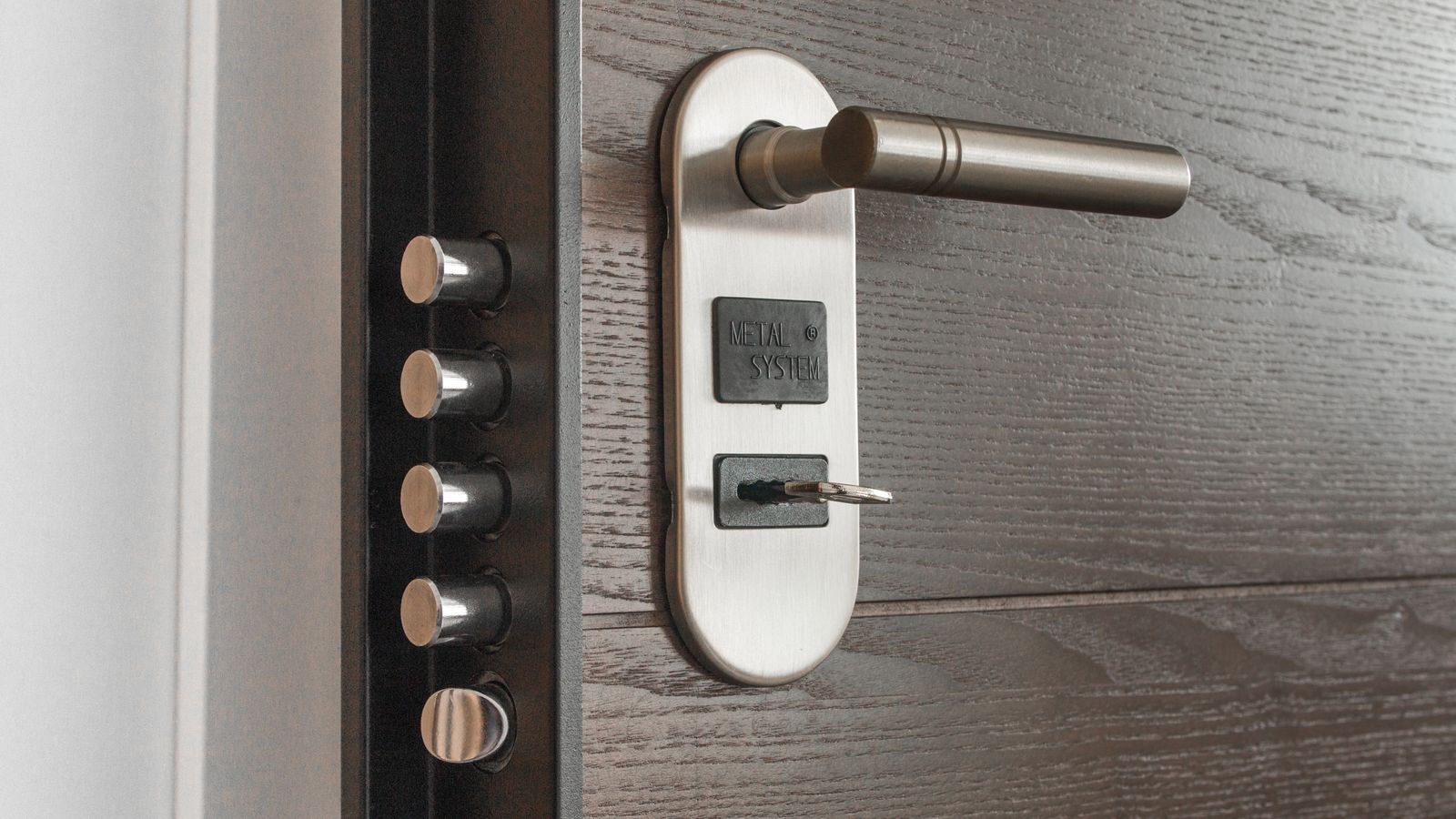 Door lock and key on a rental apartment door for renter home security