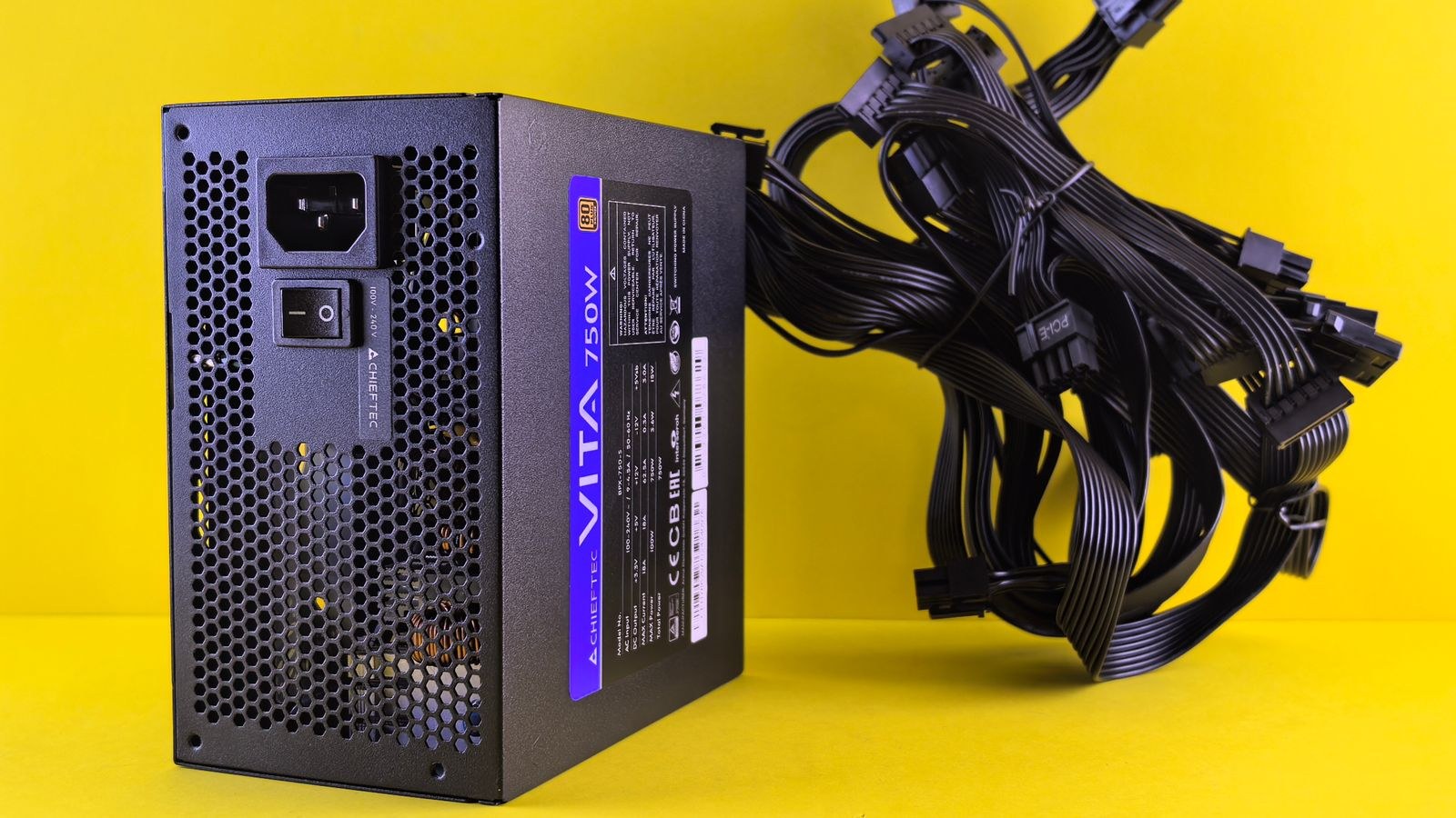 Modular power supply cables and connectors laid out during a PC PSU replacement