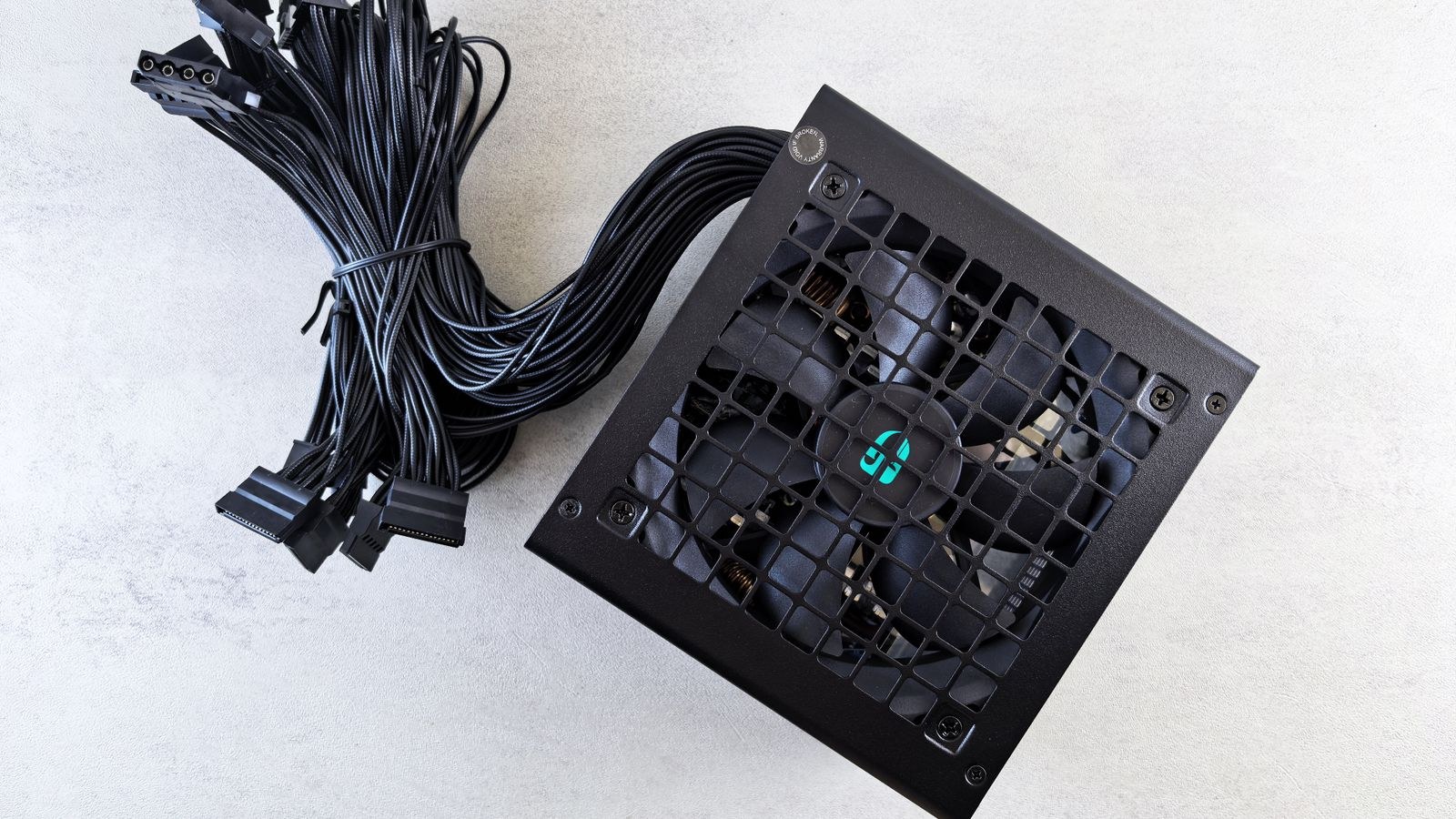 New computer power supply unit with connector cables before installation in a desktop
