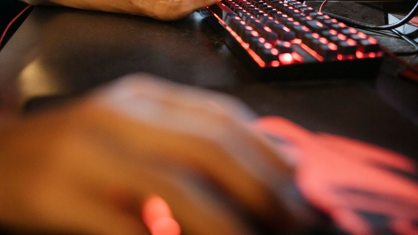 Players in a competitive PC gaming session with fast monitors and RGB peripherals