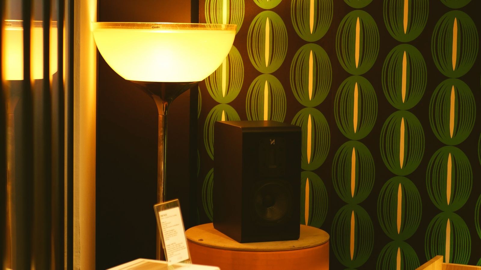Contemporary room with modern speakers and floor lamp illustrating speaker placement