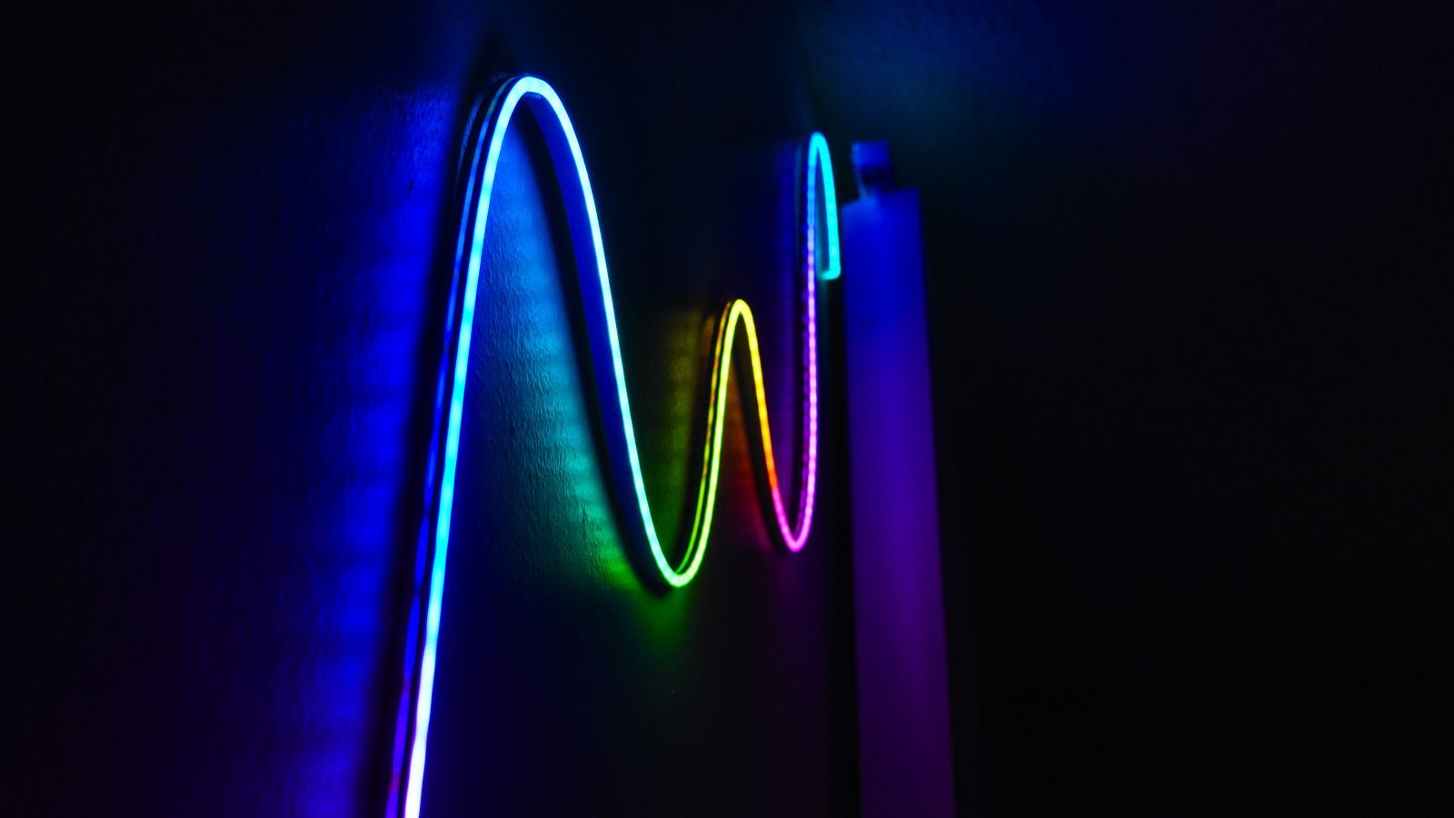 Colorful LED strip light producing a smooth wave of continuous illumination