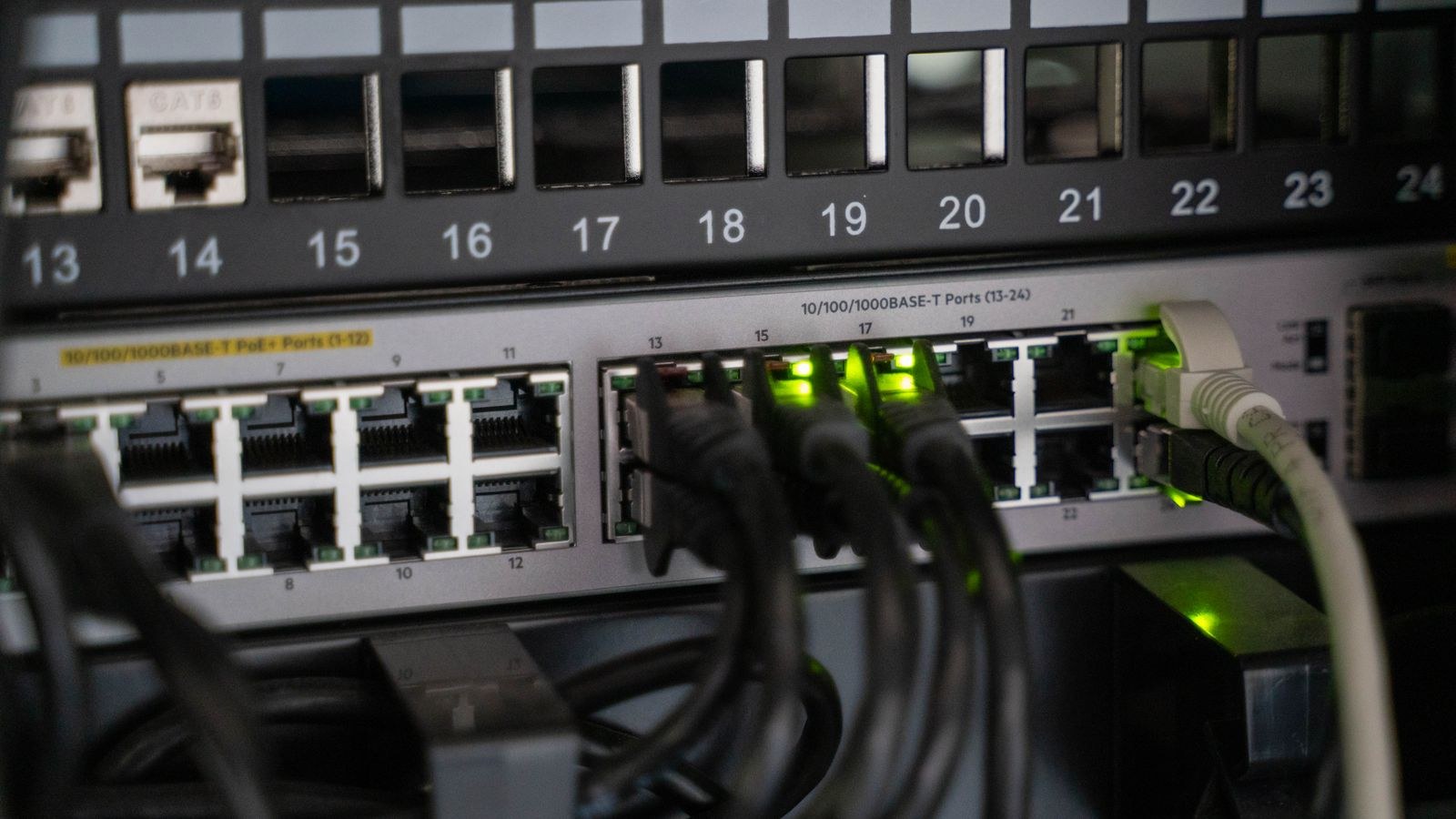 Networking equipment with connected cables showing router hardware performance
