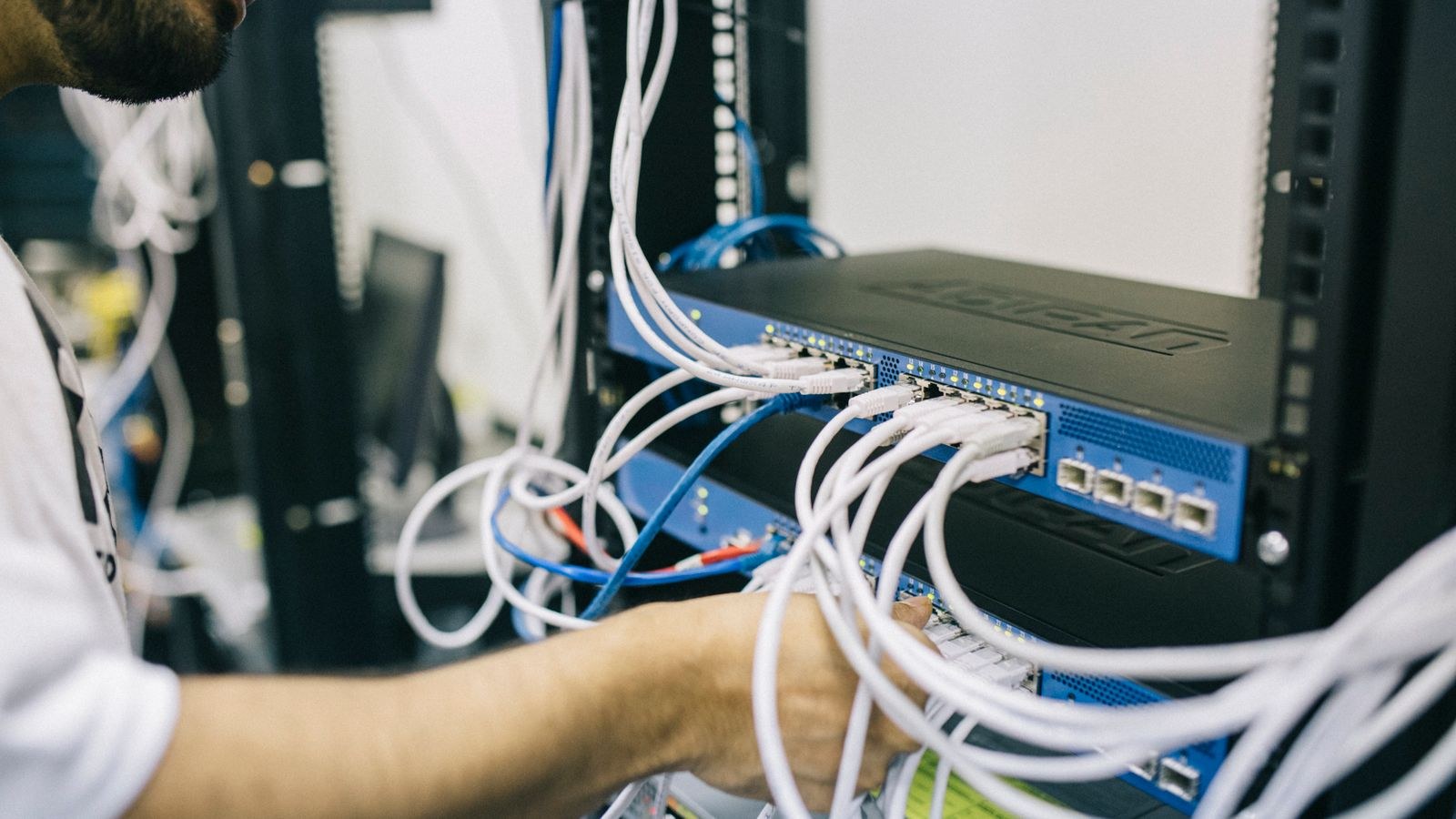 Technician configuring home network equipment and security settings