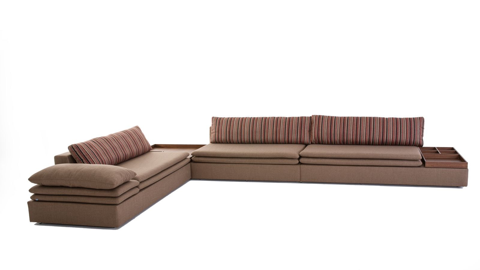 Brown L-shaped sectional sofa with striped cushions in a modern living room