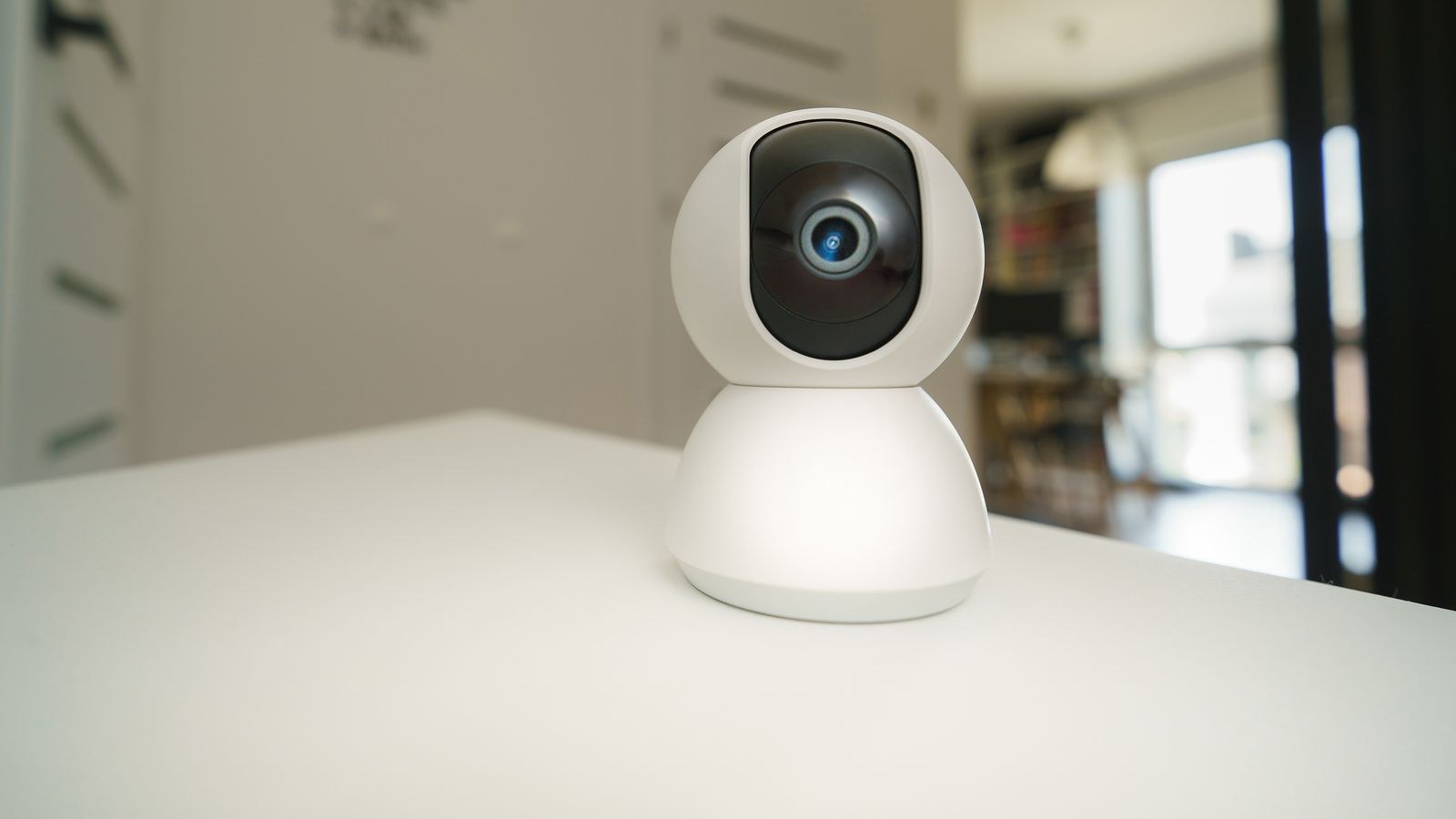 Modern home security camera being inspected during maintenance