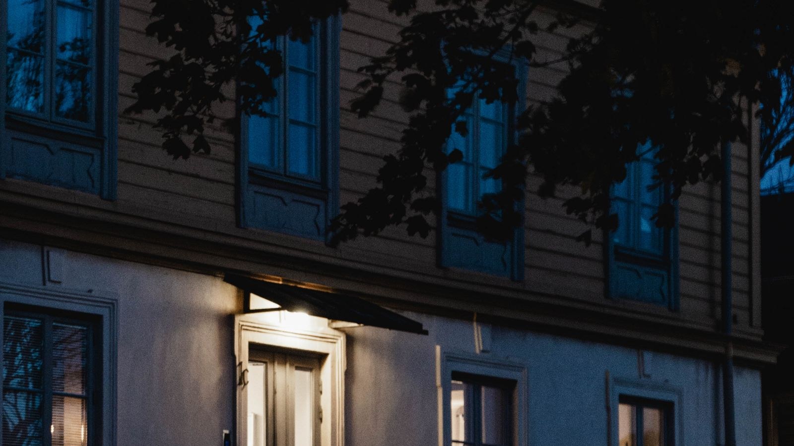 Cozy house illuminated at night showing ambient light for colour night vision cameras