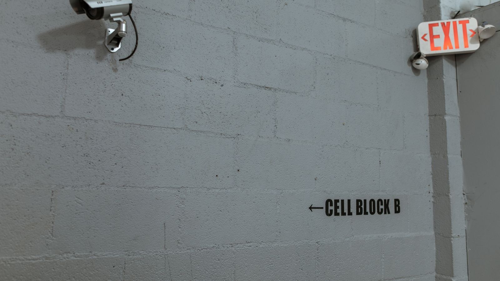 Wall-mounted surveillance camera representing indoor camera privacy considerations