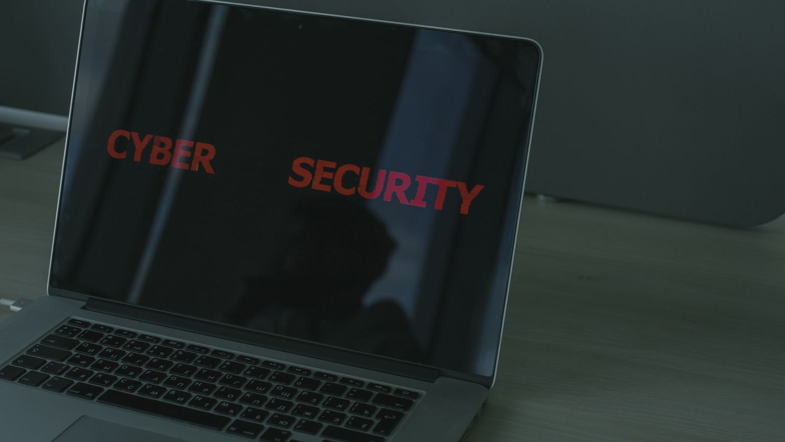Laptop screen showing network security settings while configuring router firewall rules