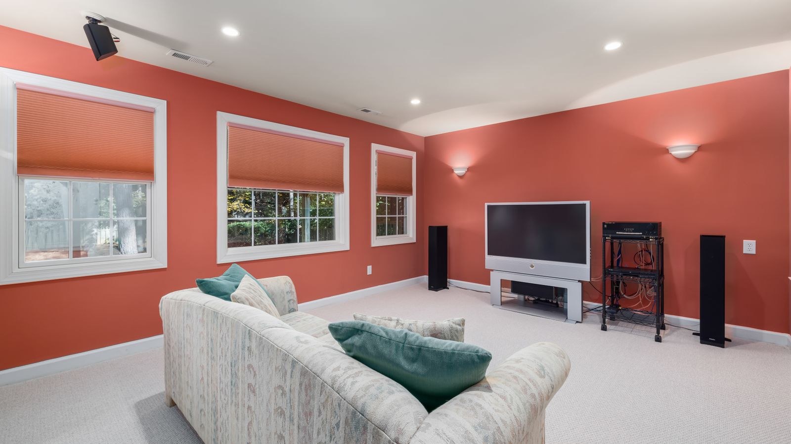 Home theater room with flat screen TV and surround sound seating layout