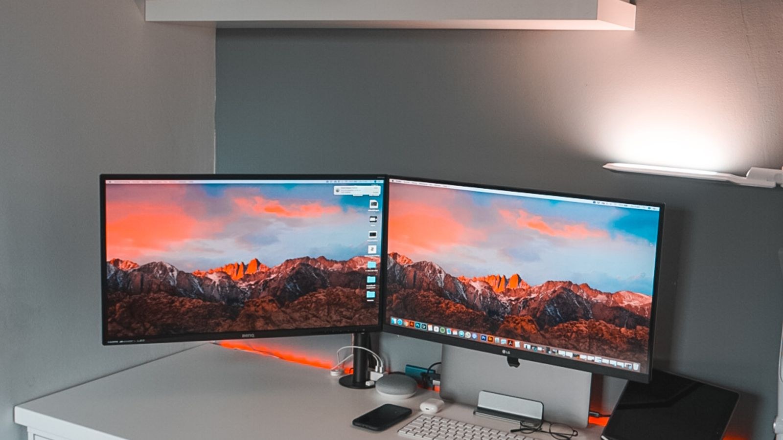 Sleek dual monitor workspace with a minimalist keyboard and mouse setup