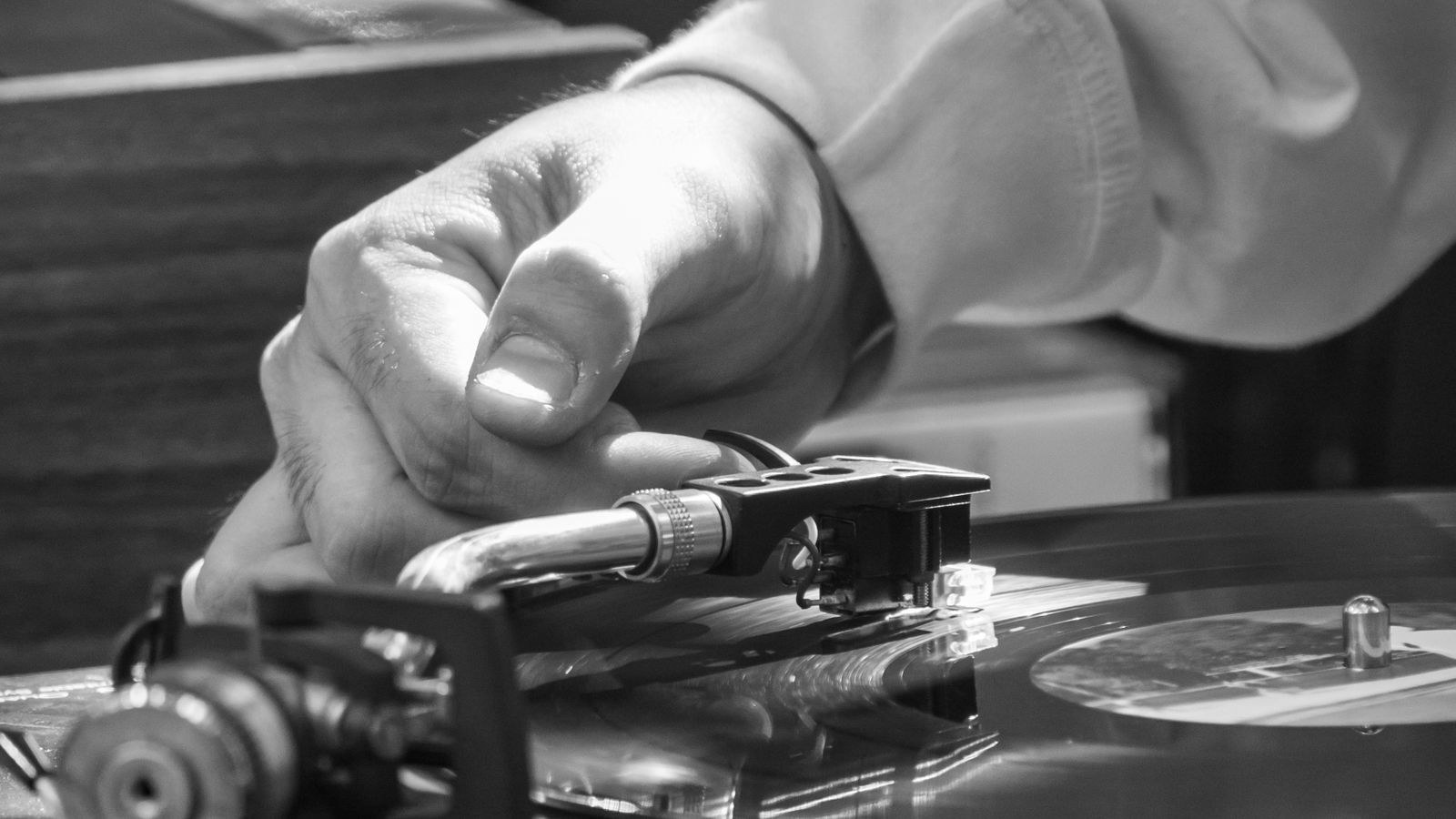 Close up of turntable tonearm counterweight and anti skate adjustment