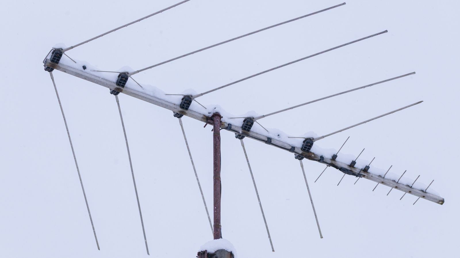 Outdoor Yagi directional TV antenna mounted outside a house