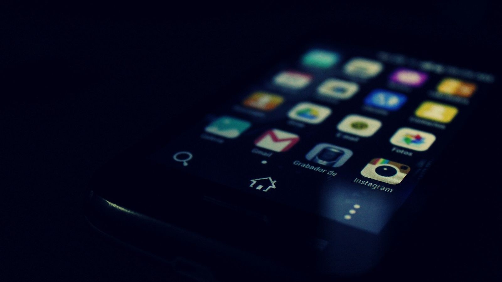 Person adjusting smart home settings on a phone at home