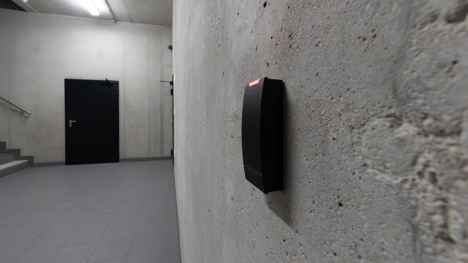 Electronic access terminal mounted beside a doorway for automated entry