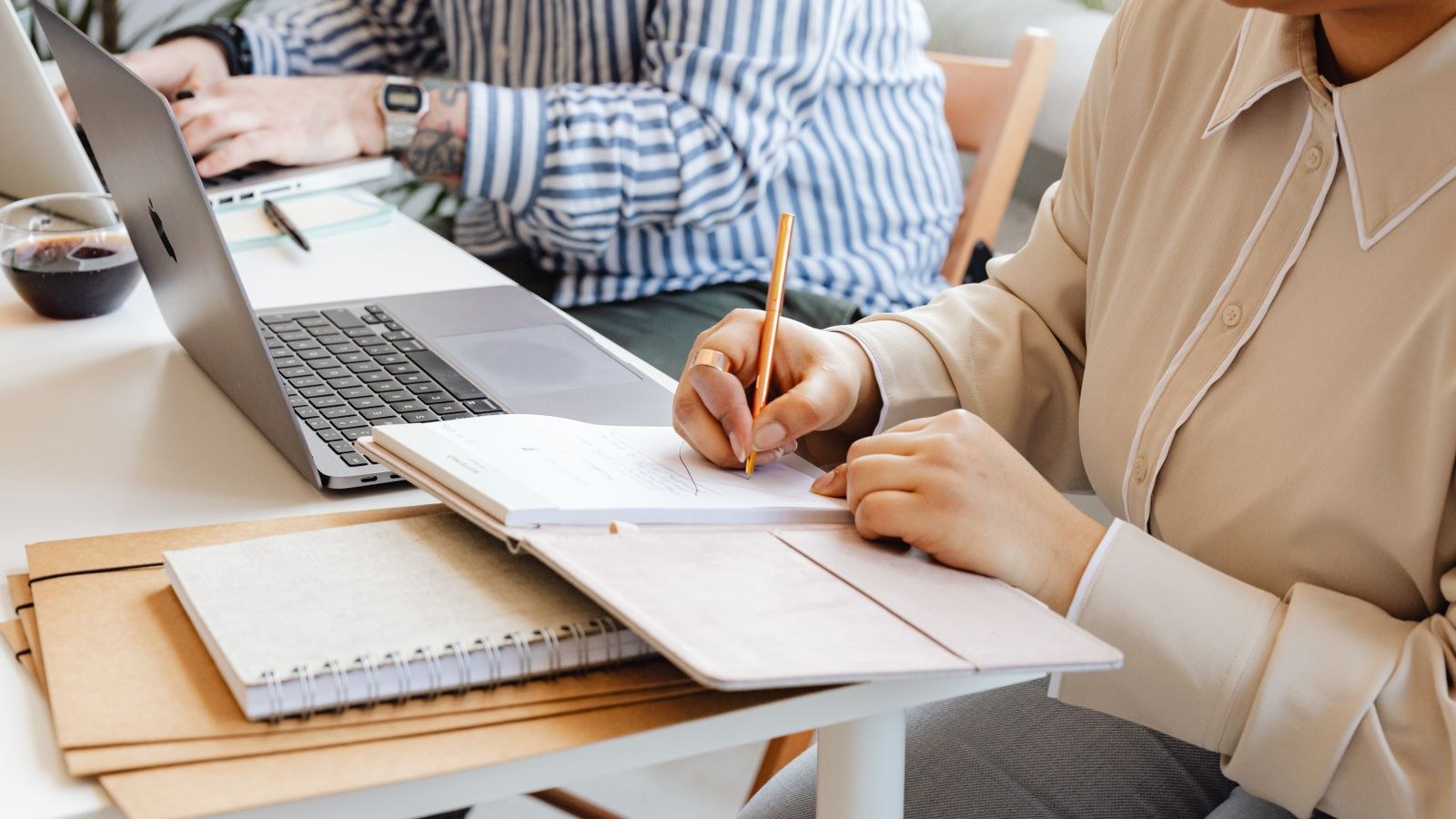 Wide desk arranged for two users with separate work zones