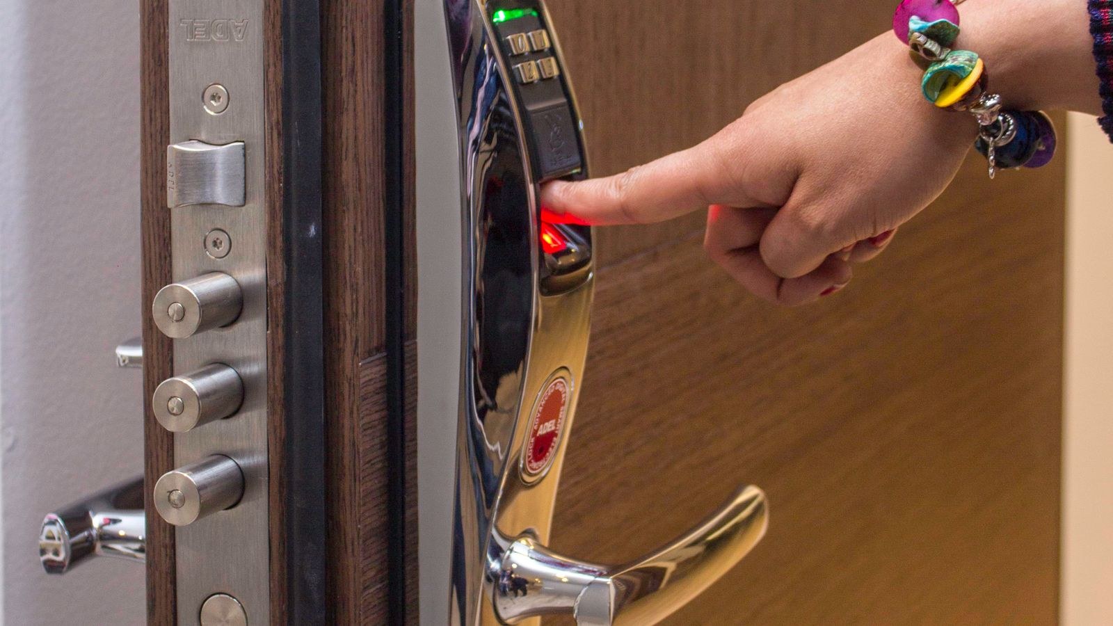 Fingerprint and code access on a digital door lock used by family members