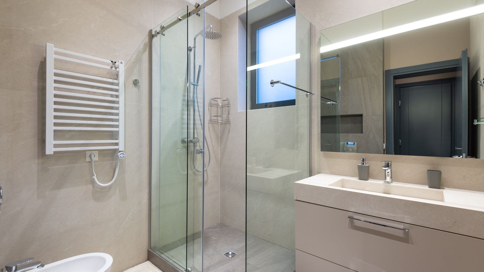 Modern bathroom with glass shower and minimalist fixtures suited to smart upgrades