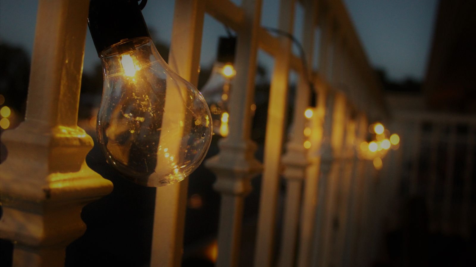 Colour changing smart bulbs creating accent lighting in a bedroom