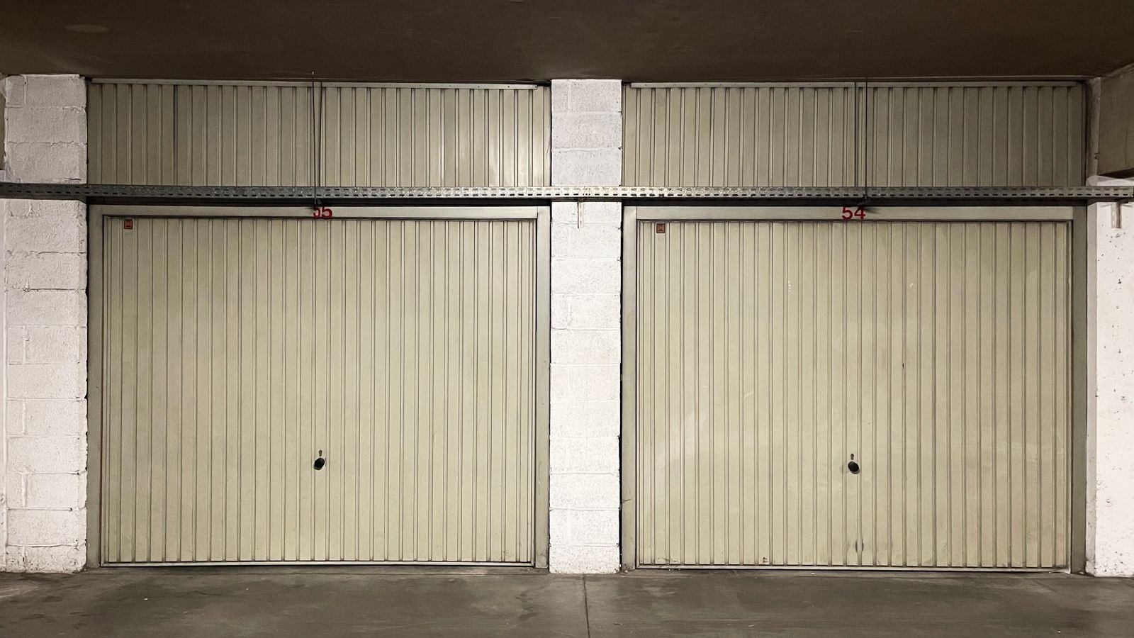 Row of closed residential garage doors on a suburban home