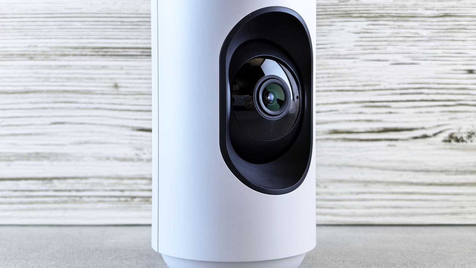 Indoor security camera on a shelf illustrating home video privacy choices