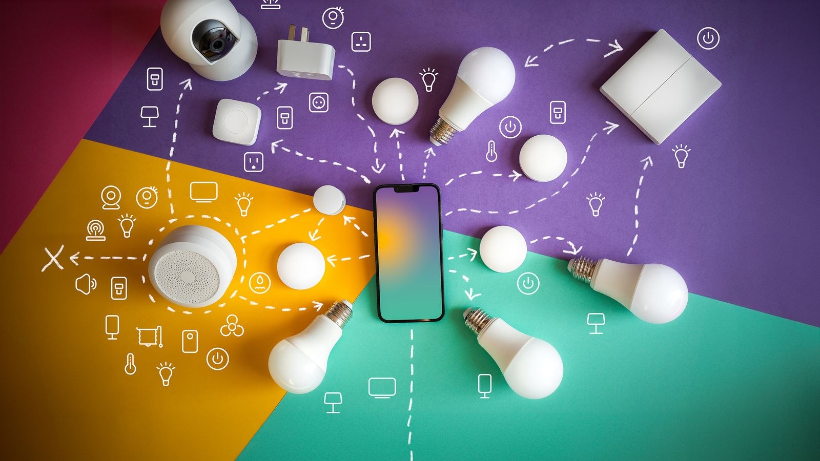 Flat lay of smart home security devices with a smartphone hub