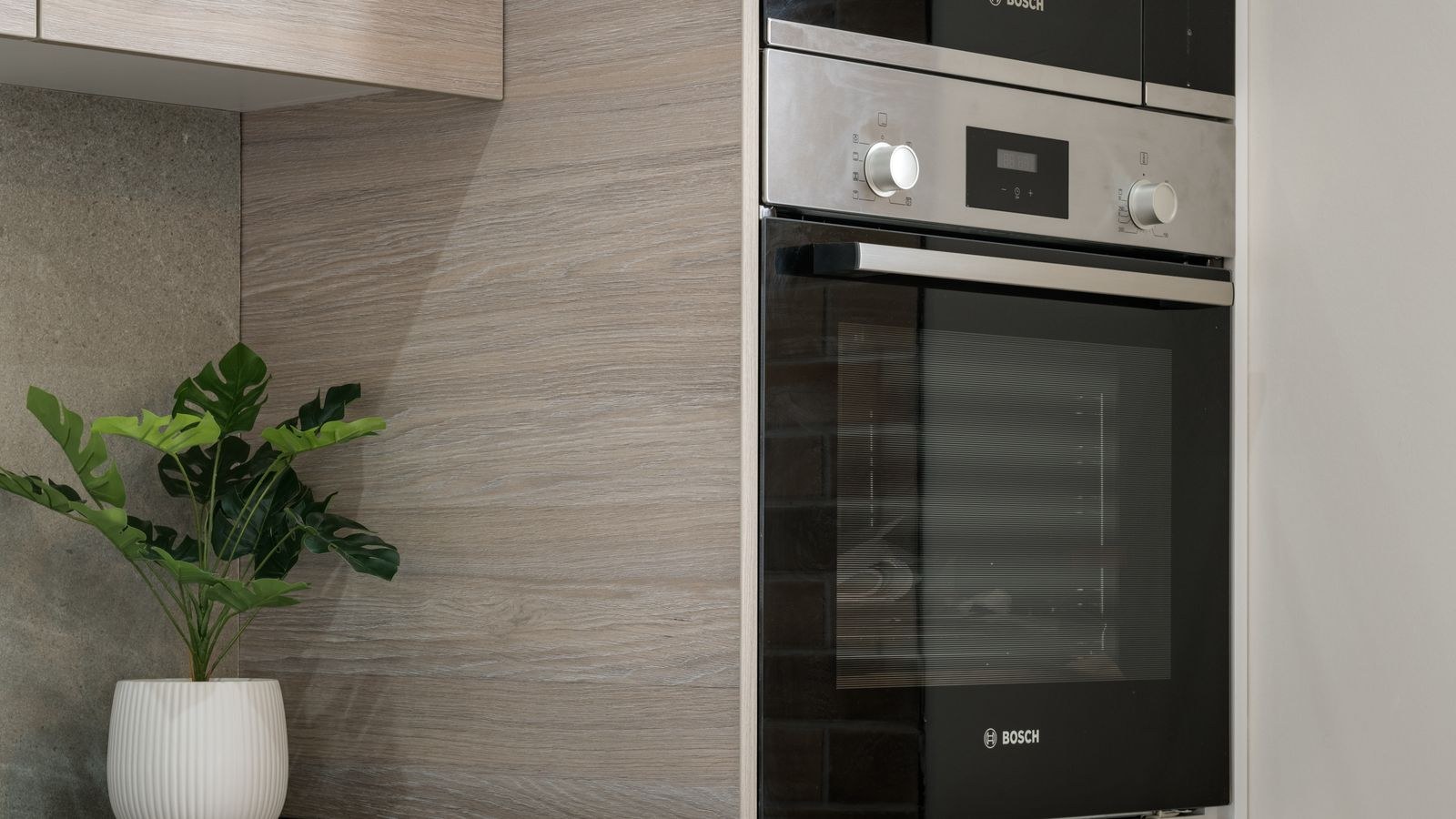 Sleek modern kitchen with built-in appliances and smart lighting