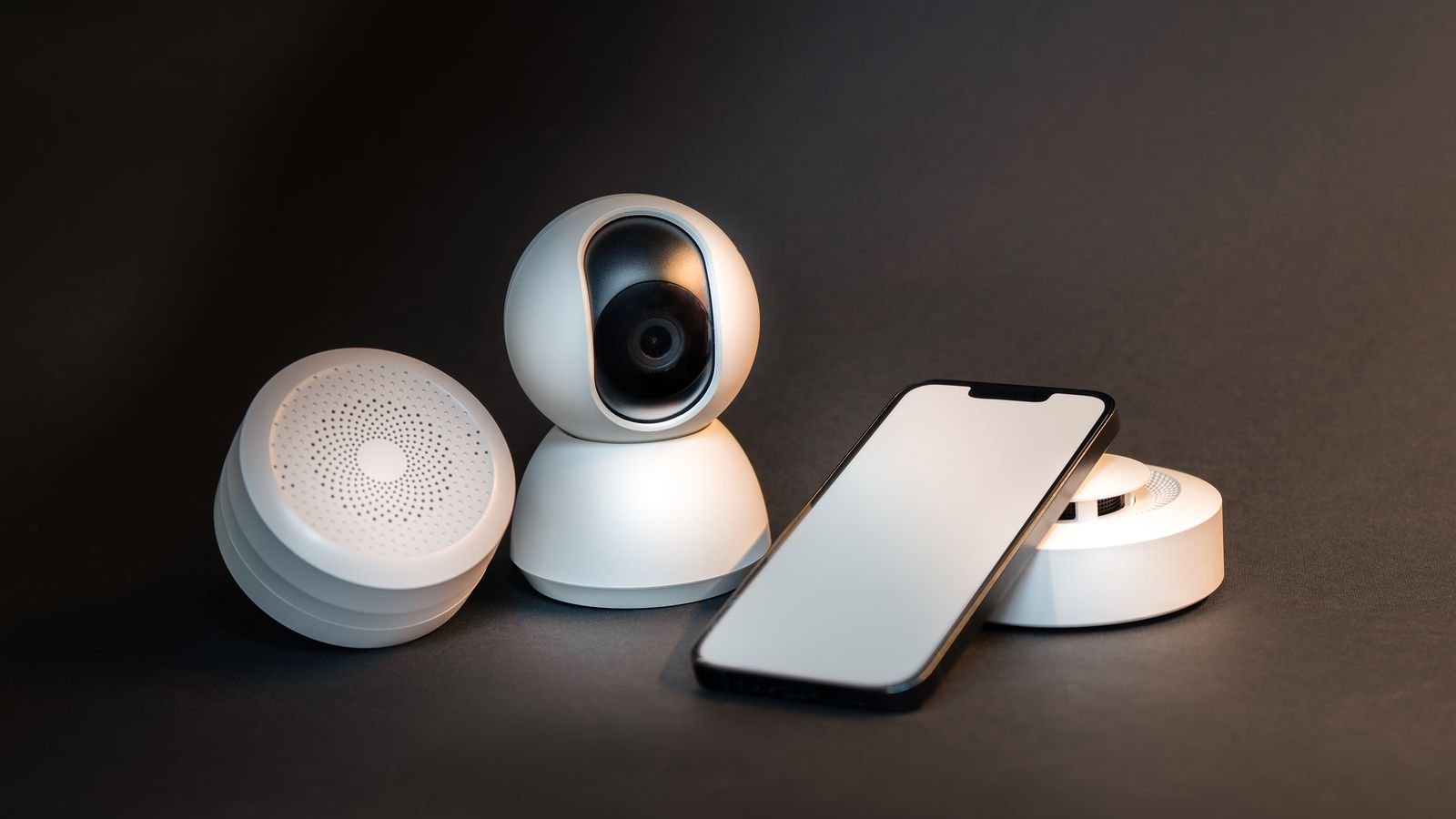 Smartphone controlling smart home devices on a plain background