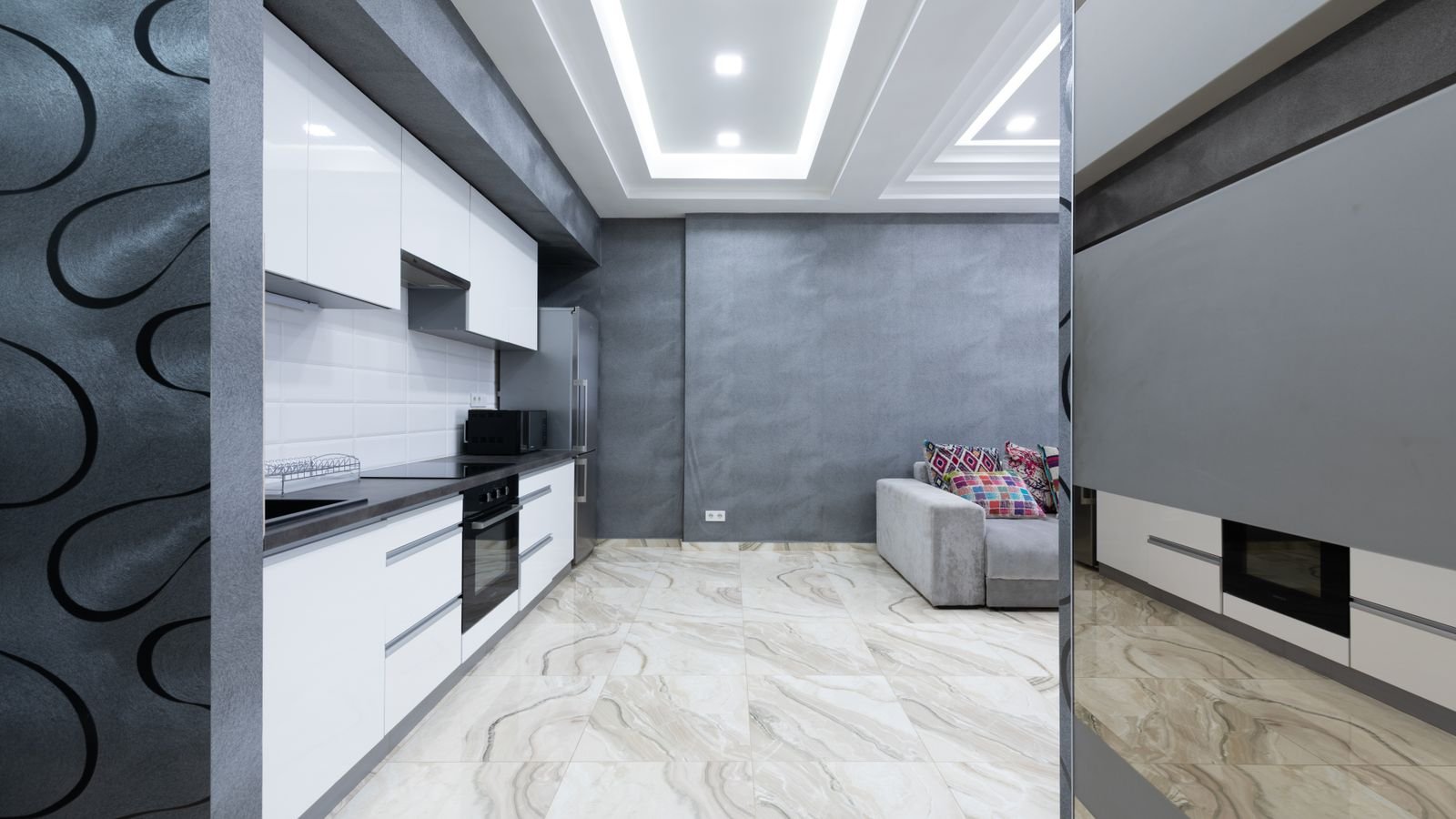 Recessed ceiling lights arranged in a grid across a bright room