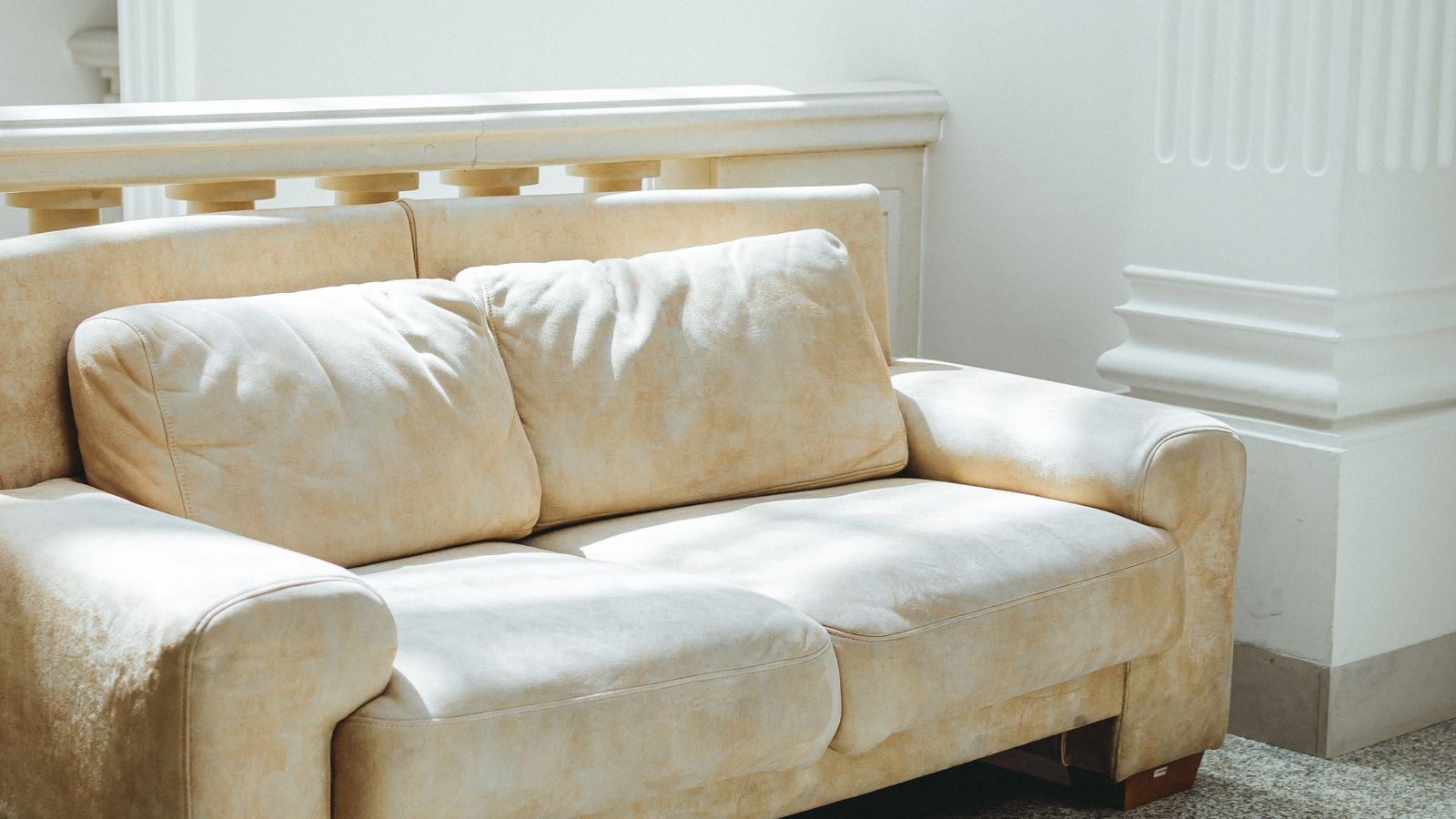 Luxurious beige sofa in a bright modern living room