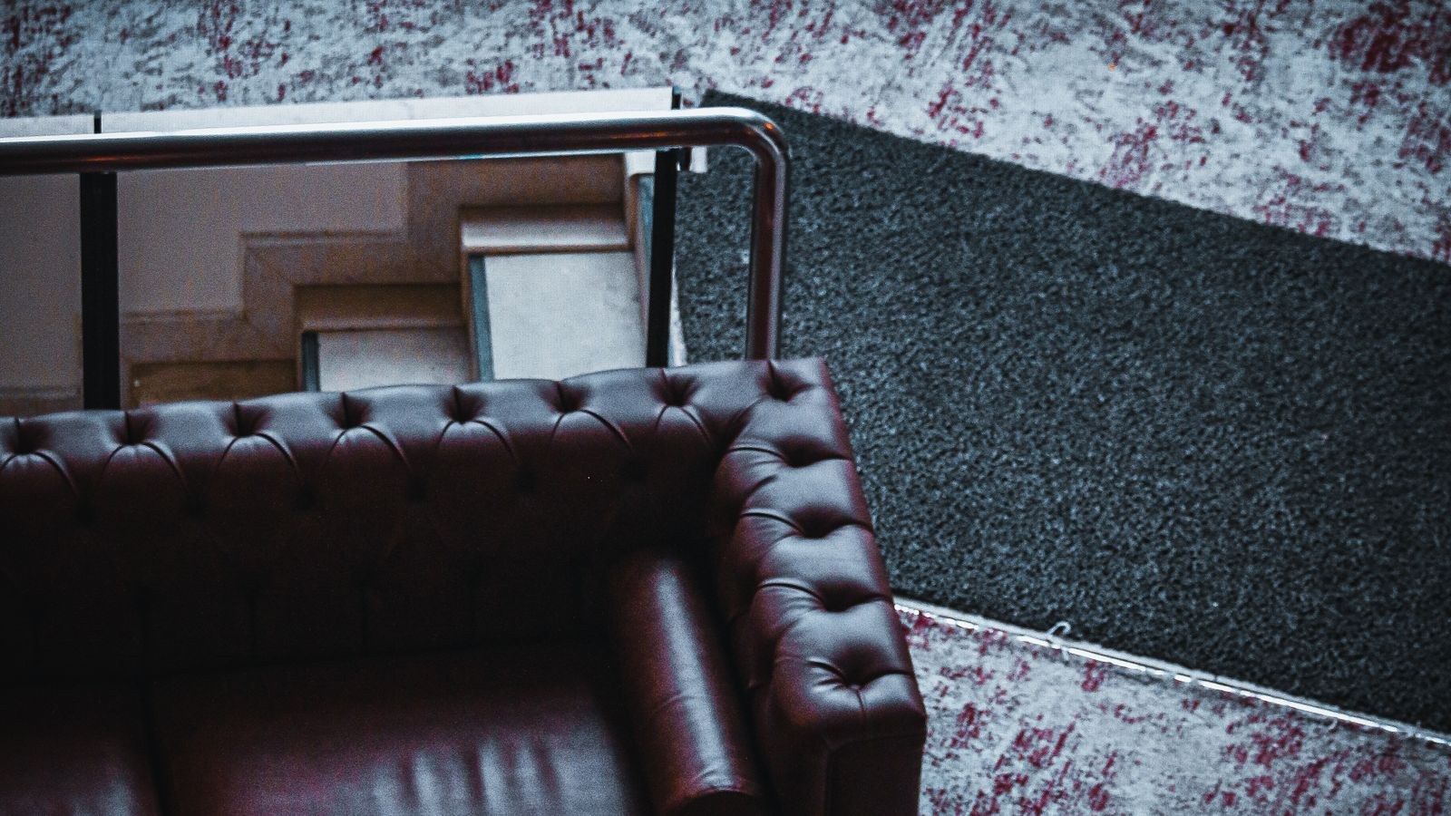 Leather sofa and armchair arranged in a living room seating layout