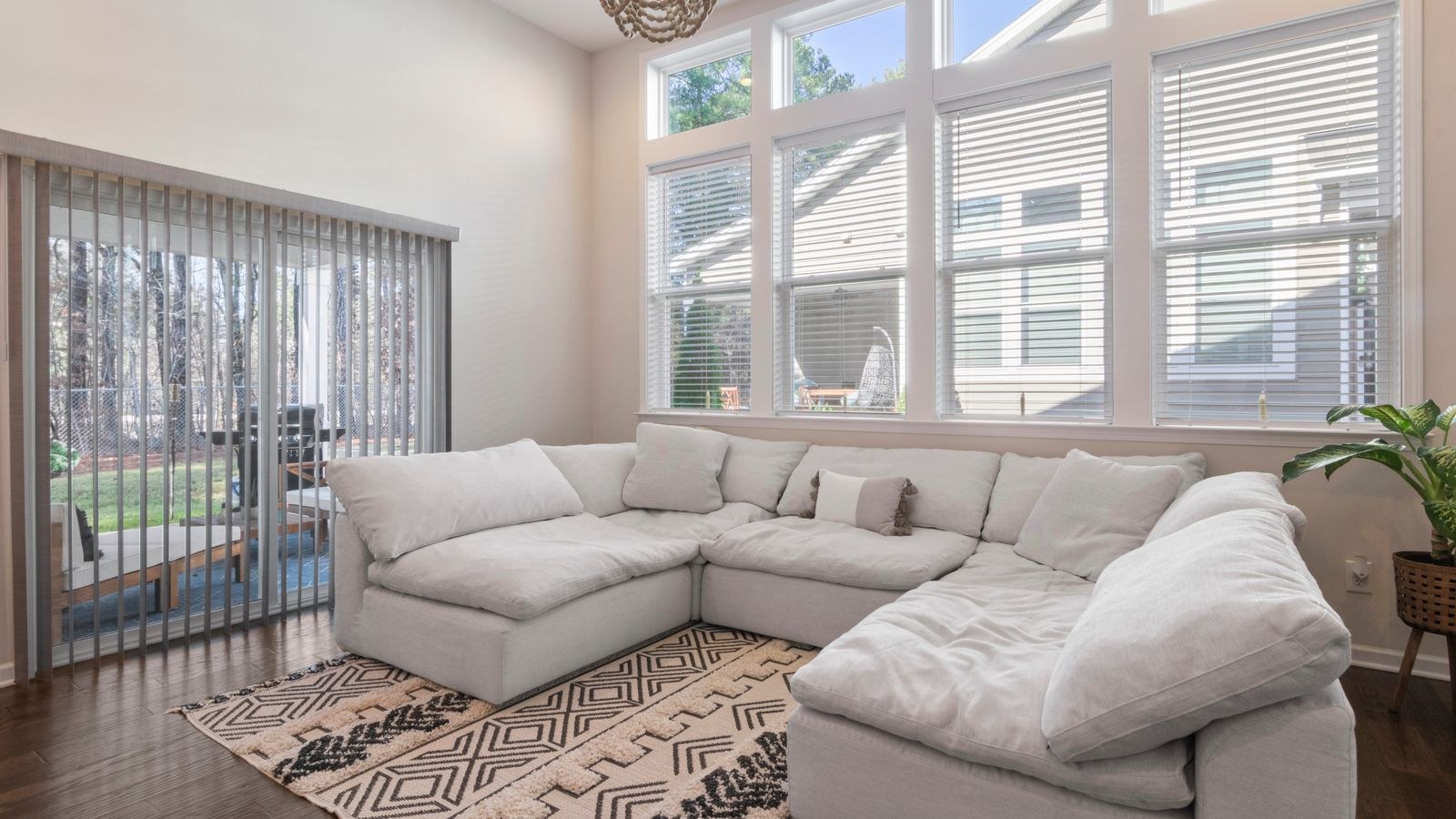 Plush sectional sofa in a modern living room with large windows
