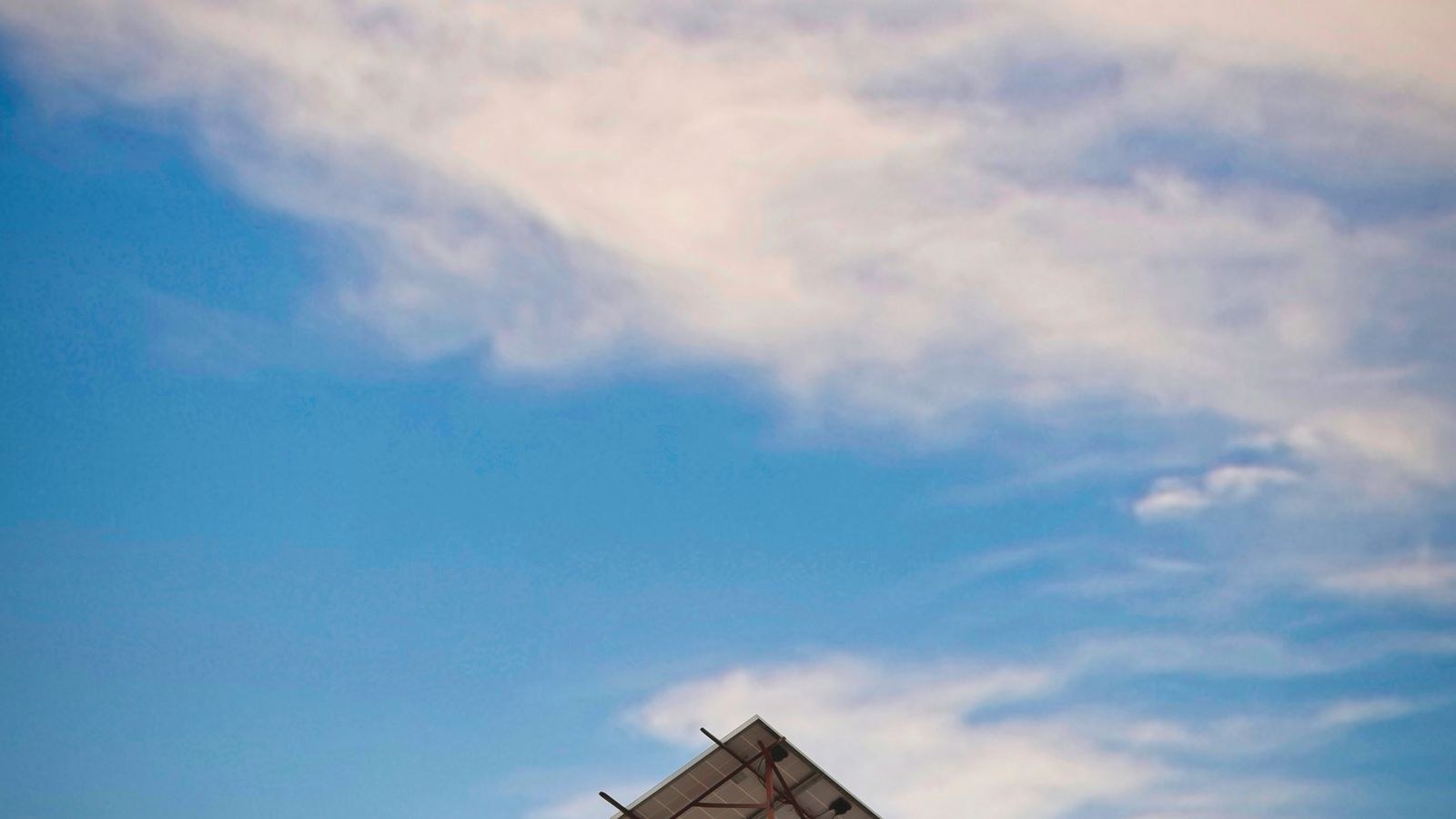 Rooftop solar panel array angled toward the sun for off grid power