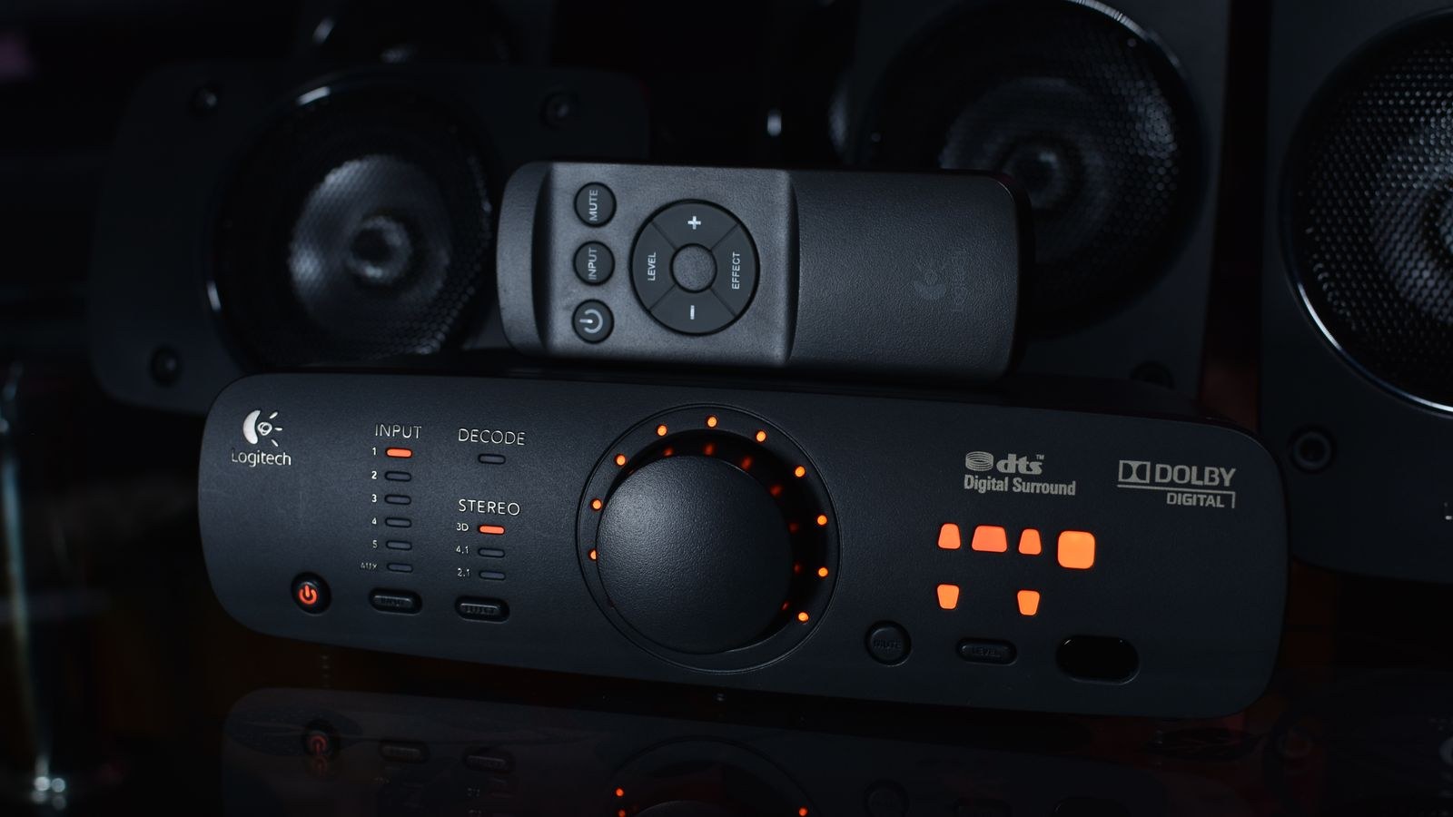 Close up of home audio equipment showing surround sound format indicators