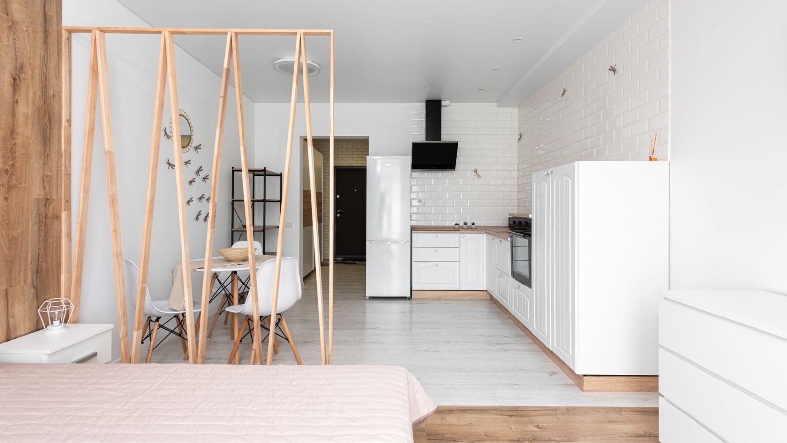 Open plan studio apartment with kitchen and minimalist living zone