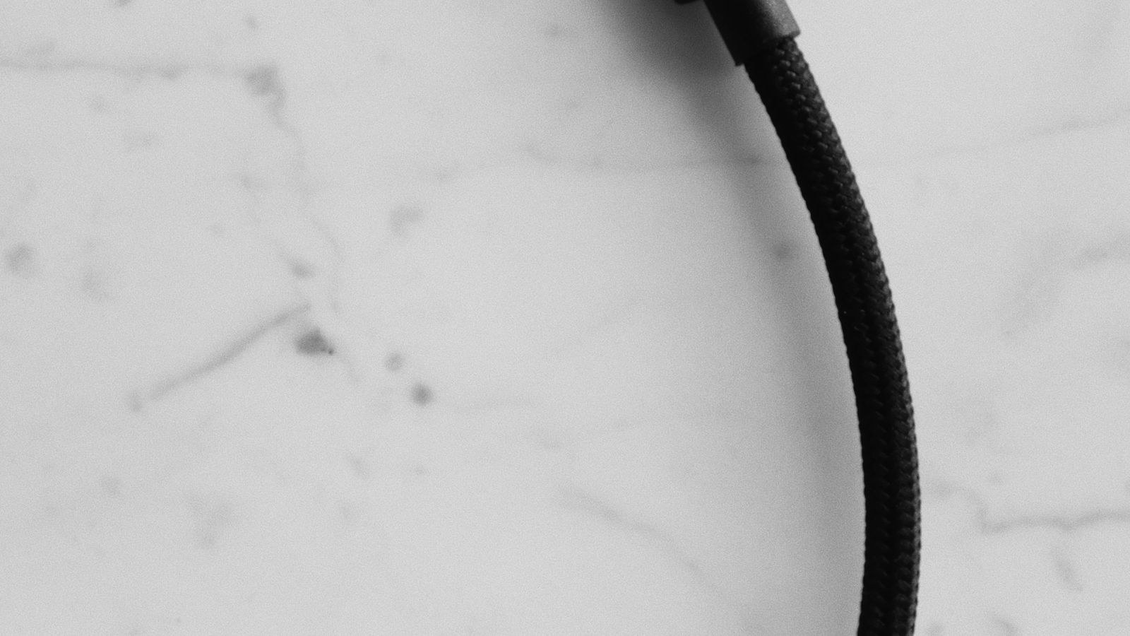USB-C fast charging cable connected to a device on a desk