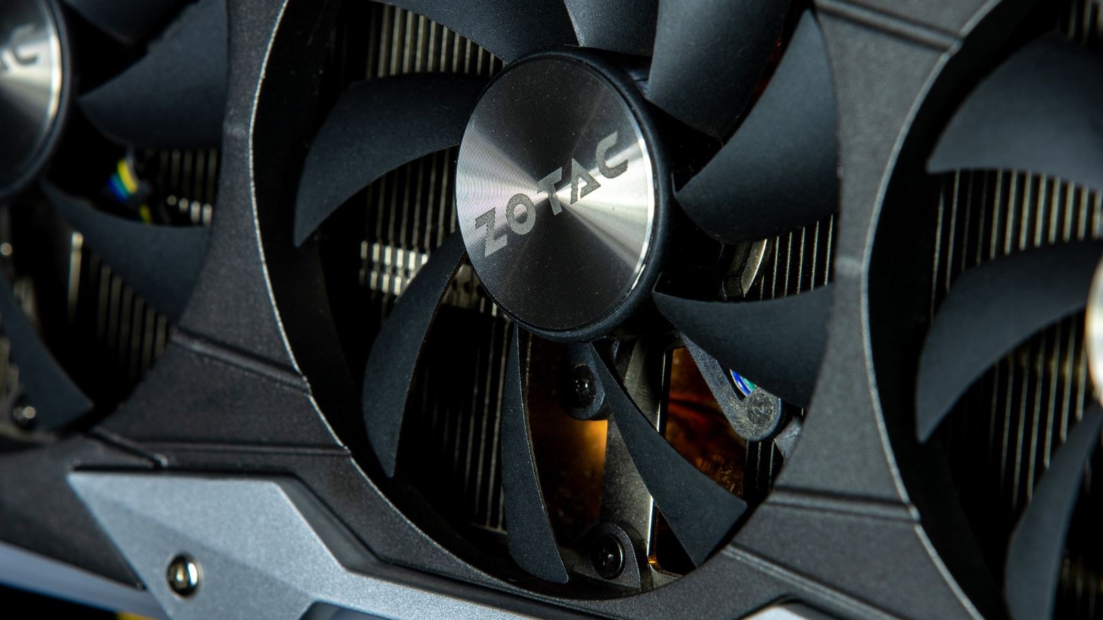 Cooling fan on a graphics card being checked for dust and bearing wear