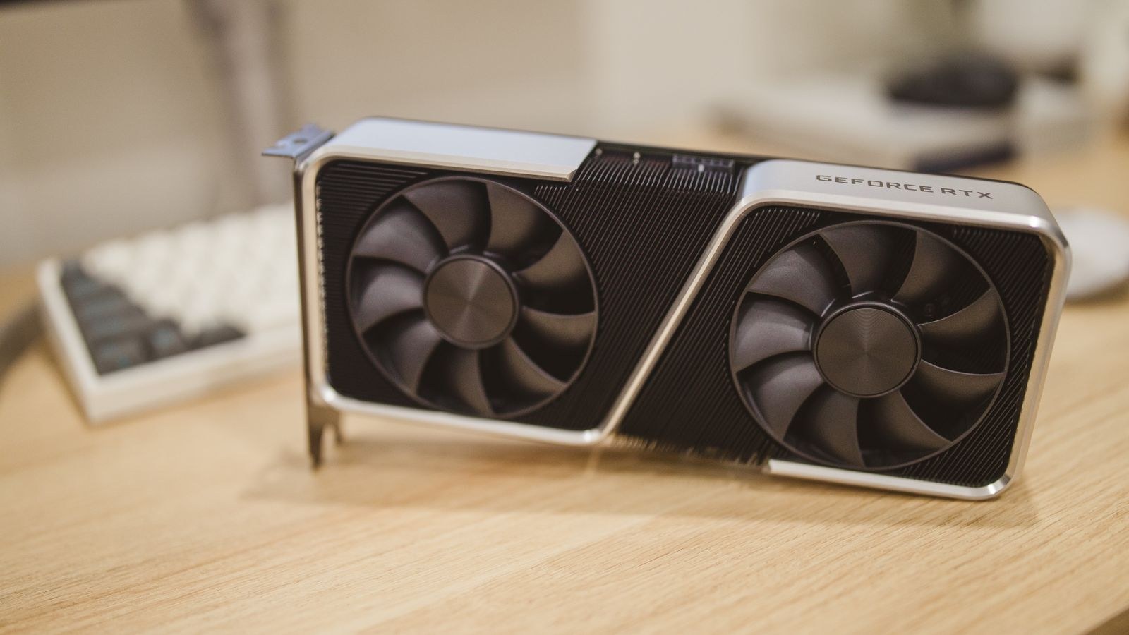 Modern graphics card on a desk during troubleshooting of a failing GPU