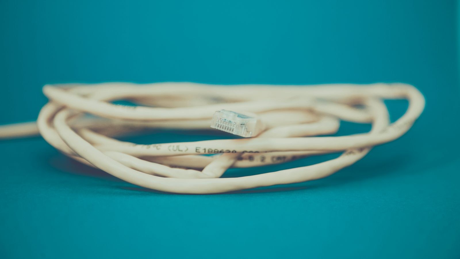 Coiled Cat6 network cable with RJ45 connector ready for termination