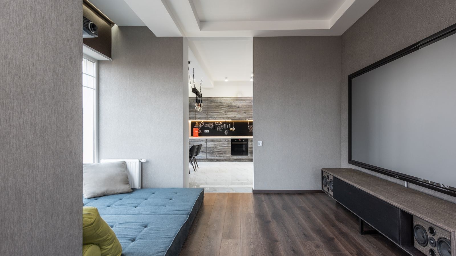 How to Tidy the Cable Mess Behind a Wall-Mounted TV