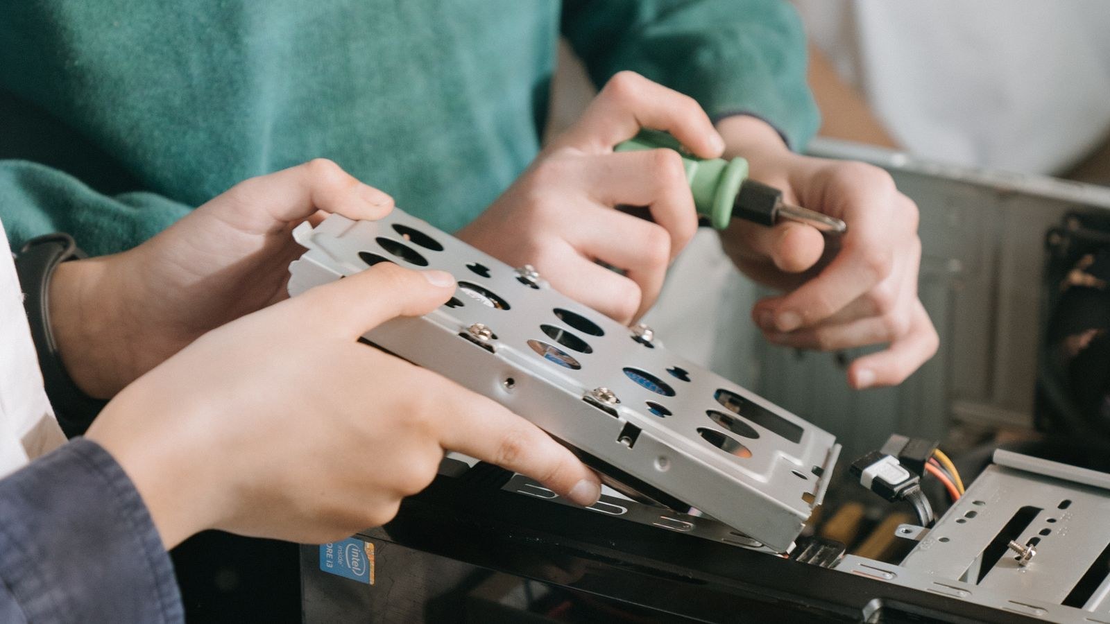 Computer repair technician working on a desktop system to fix crash errors