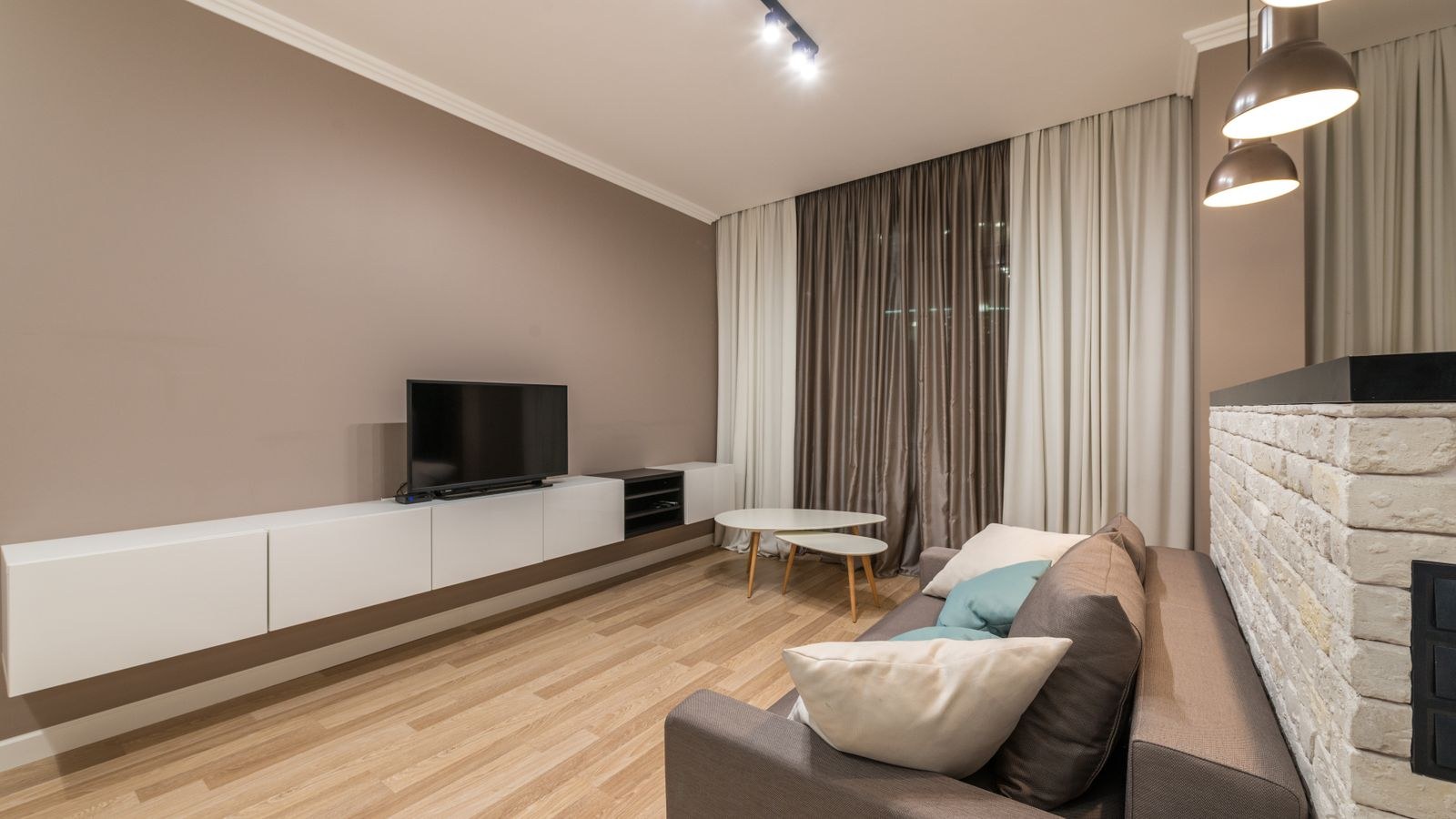 Living room television positioned above a low cabinet at seated eye level