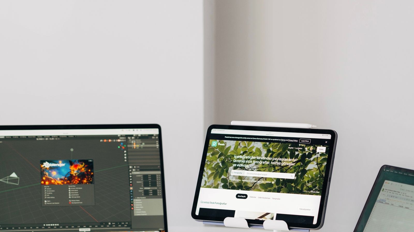 Home office desk with two laptops, tablet and cable management for a shared workspace